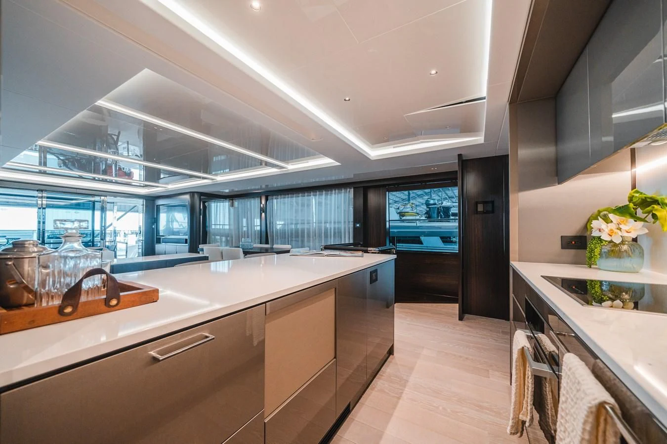 a kitchen with a large island aboard 90 OCEAN Yacht for Sale