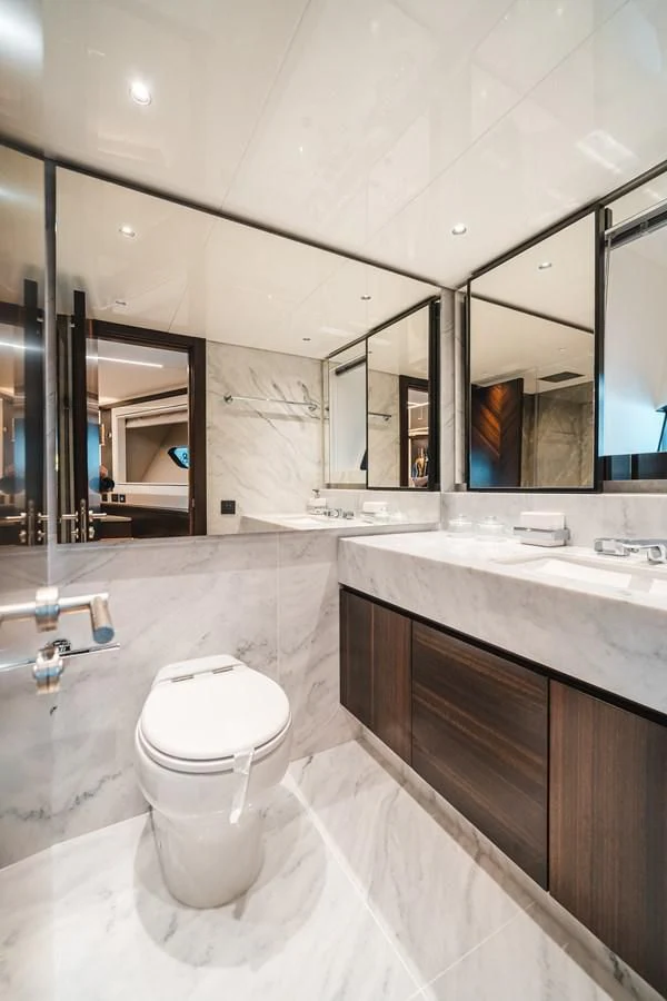 a bathroom with a toilet and a sink aboard 90 OCEAN Yacht for Sale