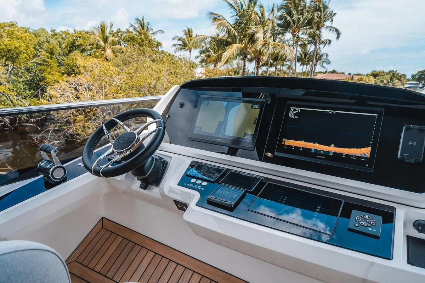 a car with a screen and a steering wheel on the dashboard aboard 90 OCEAN Yacht for Sale