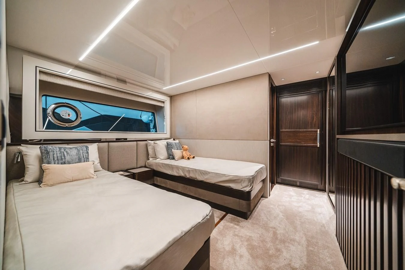a room with a bed and a tv on the wall aboard 90 OCEAN Yacht for Sale