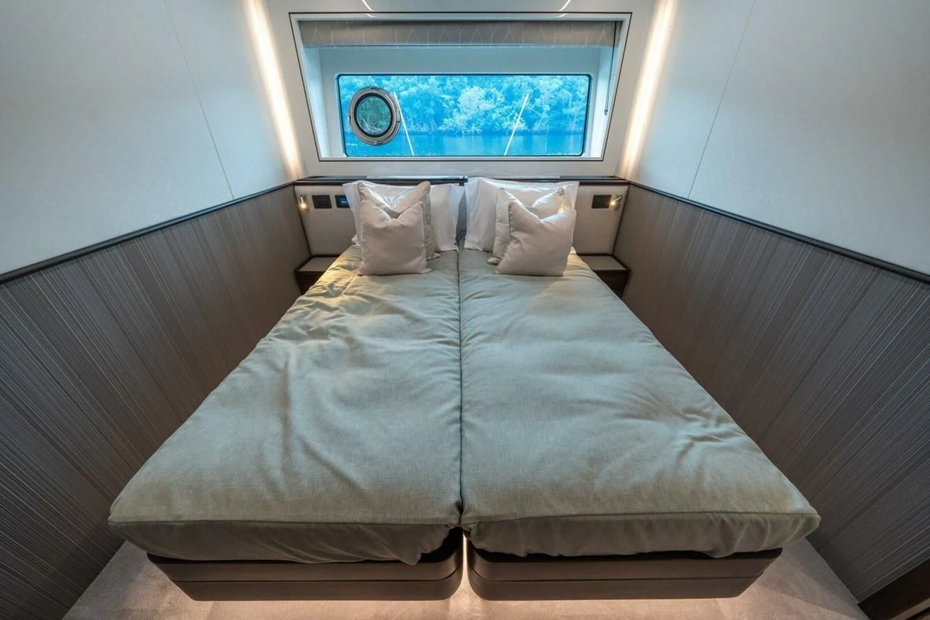 a bed with a television on the wall aboard 90 OCEAN Yacht for Sale