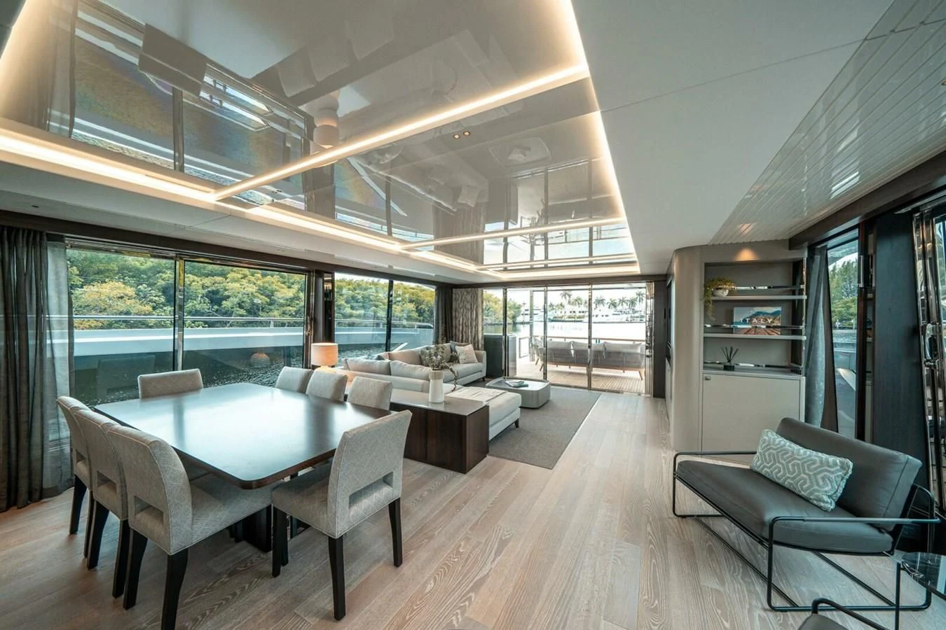 a large room with a large table and chairs aboard 90 OCEAN Yacht for Sale