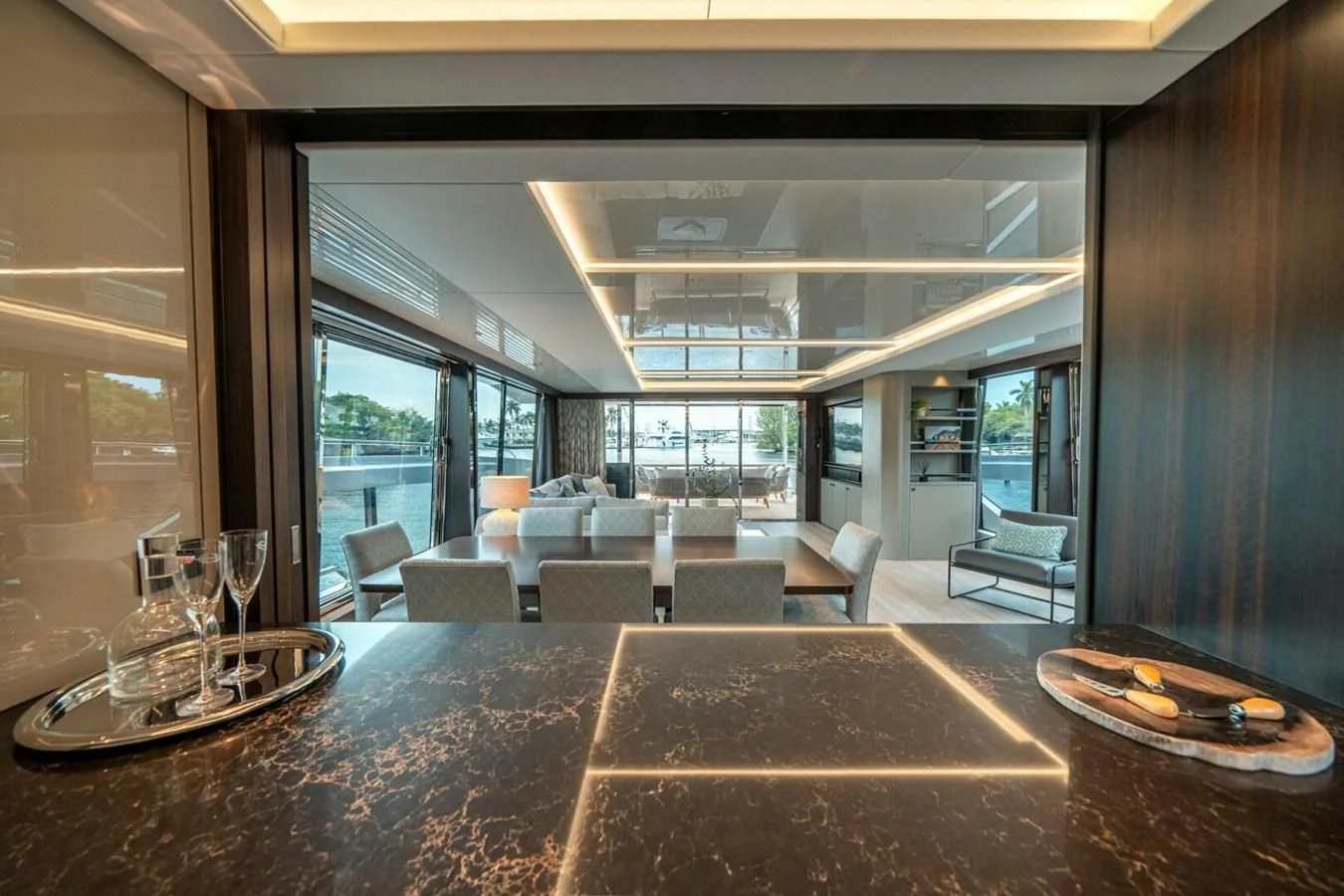 a large room with a table and chairs aboard 90 OCEAN Yacht for Sale