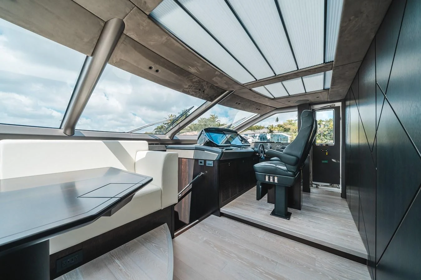 a room with a wood floor and a blue car parked in it aboard 90 OCEAN Yacht for Sale