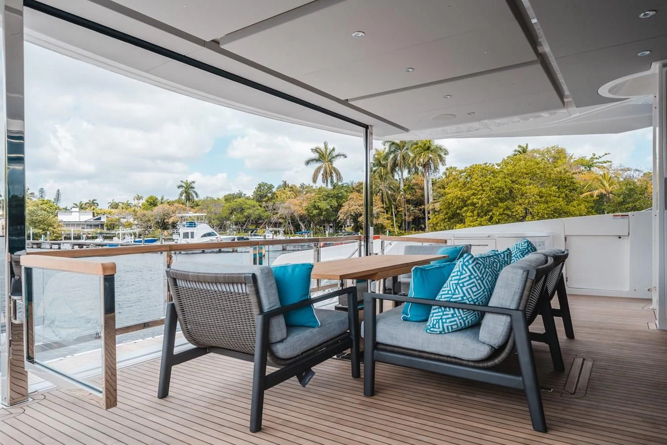a deck with chairs and a table aboard 90 OCEAN Yacht for Sale