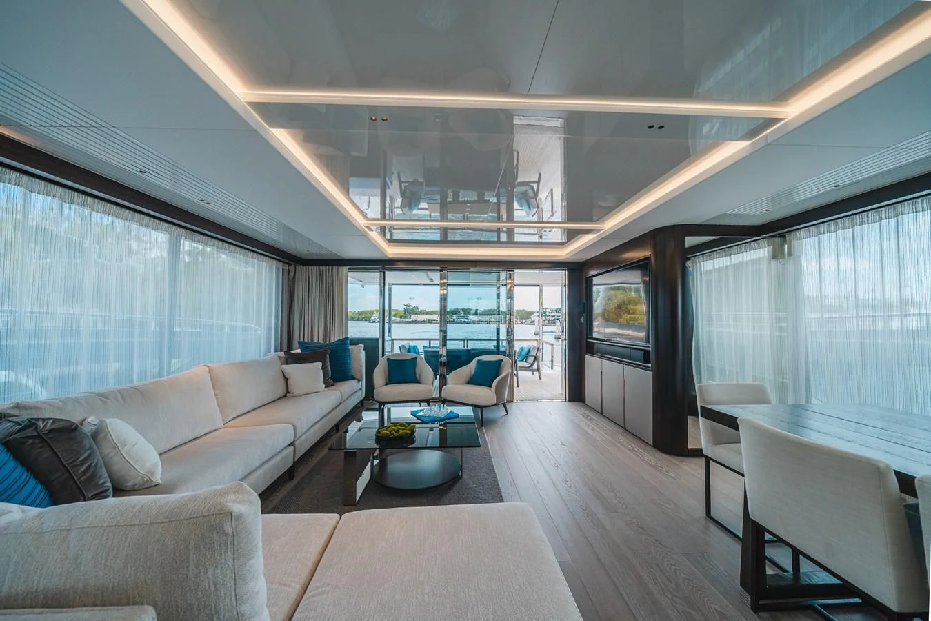 a living room with a large window aboard 90 OCEAN Yacht for Sale