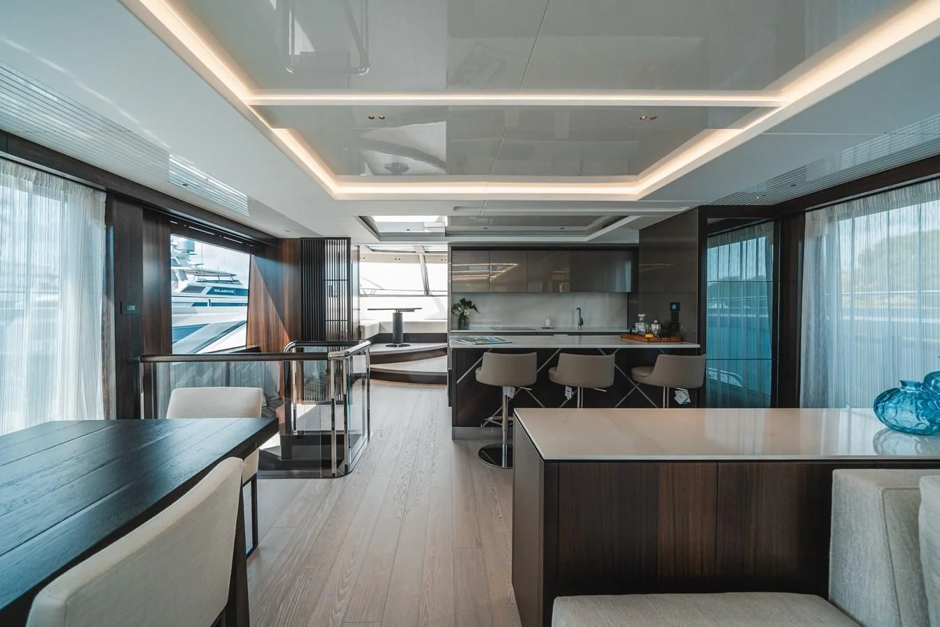 a large kitchen with a table and chairs aboard 90 OCEAN Yacht for Sale