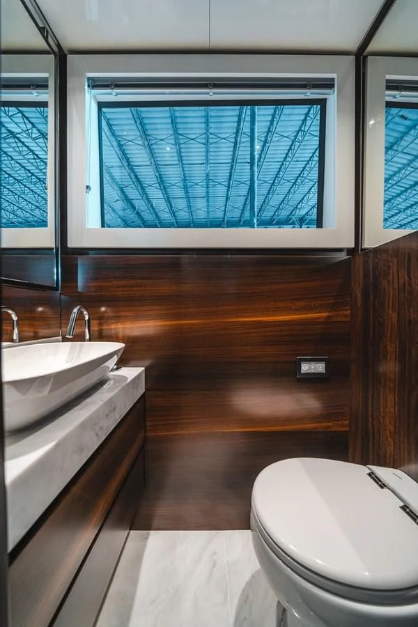 a bathroom with a sink and a toilet aboard 90 OCEAN Yacht for Sale