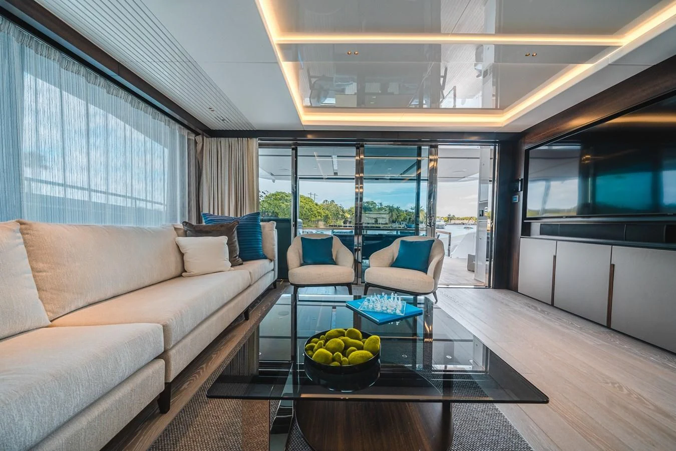 a living room with a table and couches aboard 90 OCEAN Yacht for Sale