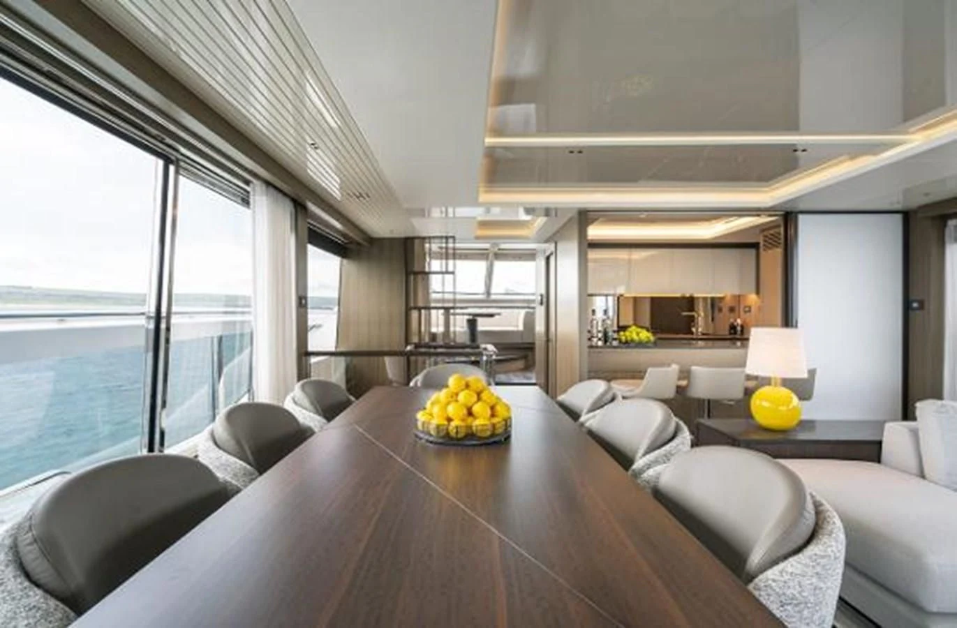 a large living room with a large table and chairs aboard 90 OCEAN Yacht for Sale