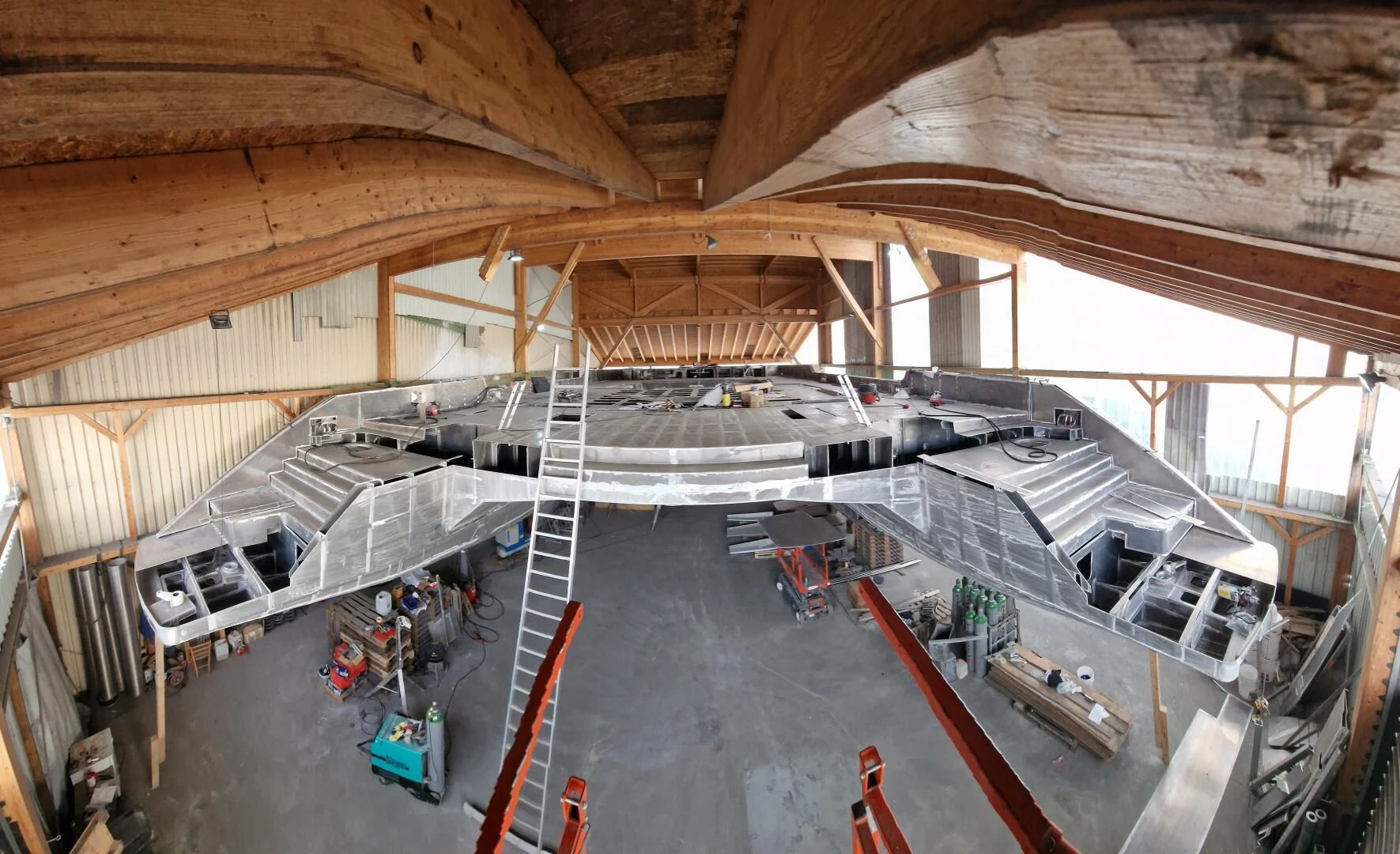 a large building with a staircase aboard CUSTOM 107 CATAMARAN Yacht for Sale