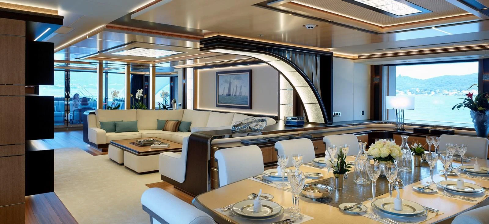 a large room with a table and chairs aboard GAJA Yacht for Sale