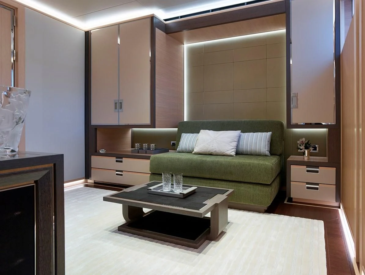 a living room with a couch and a coffee table aboard GAJA Yacht for Sale