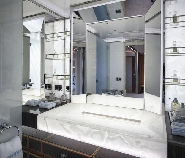 a large bathroom with a large mirror aboard GAJA Yacht for Sale