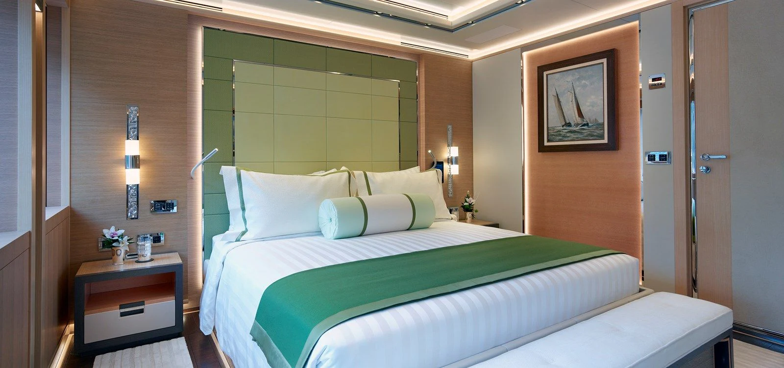 a bed with a green sheet aboard GAJA Yacht for Sale