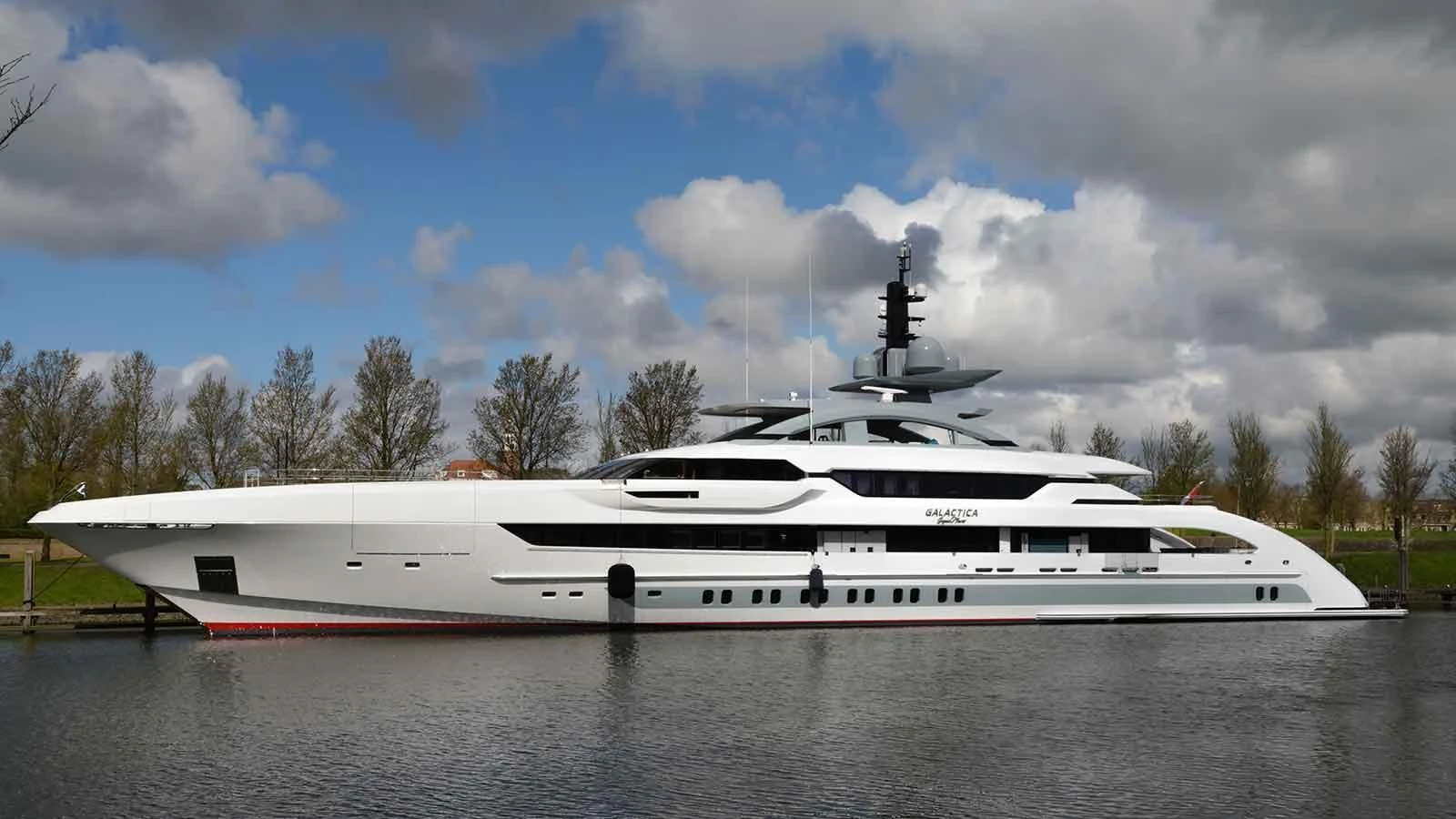 a white yacht on a river aboard GAJA Yacht for Sale