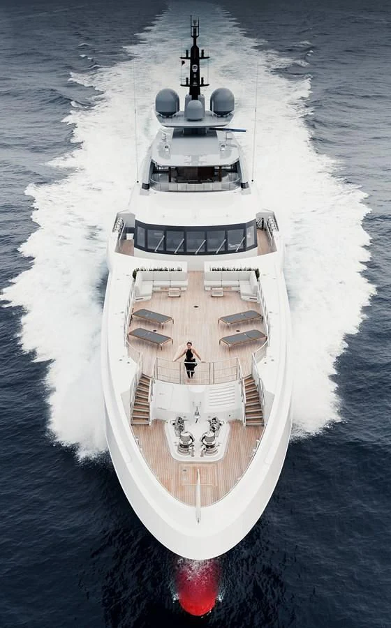 a white boat with a person standing on it aboard GAJA Yacht for Sale