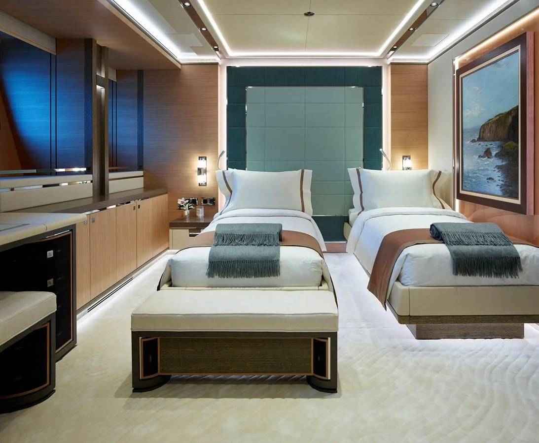 a room with a bed and a desk aboard GAJA Yacht for Sale