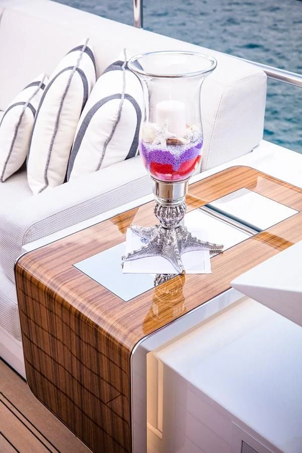 a glass of wine on a table aboard GAJA Yacht for Sale