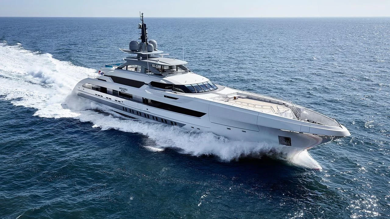 a white yacht in the ocean aboard GAJA Yacht for Sale