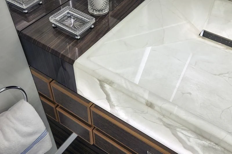 a white sheet of paper on a wooden surface aboard GAJA Yacht for Sale