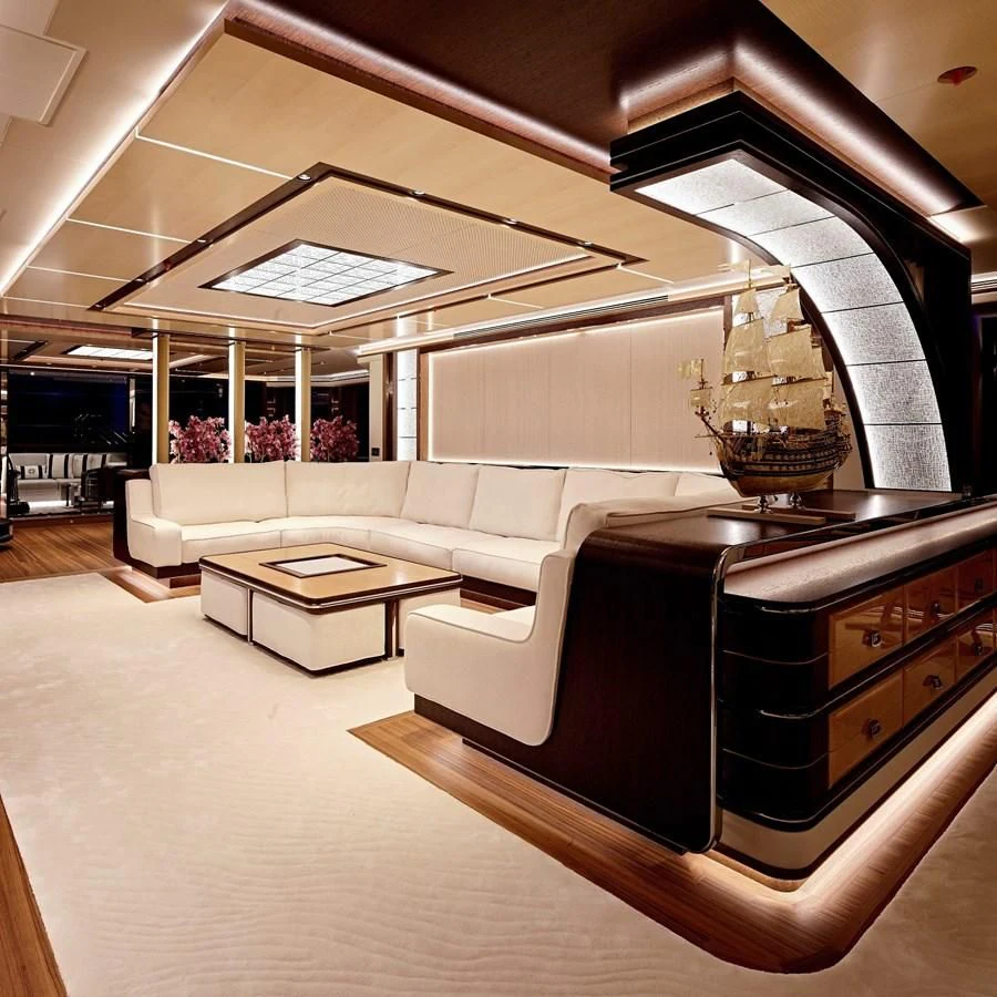 a large room with a couch and a table aboard GAJA Yacht for Sale