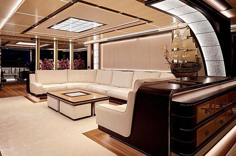 a large room with a couch and a table aboard GAJA Yacht for Sale