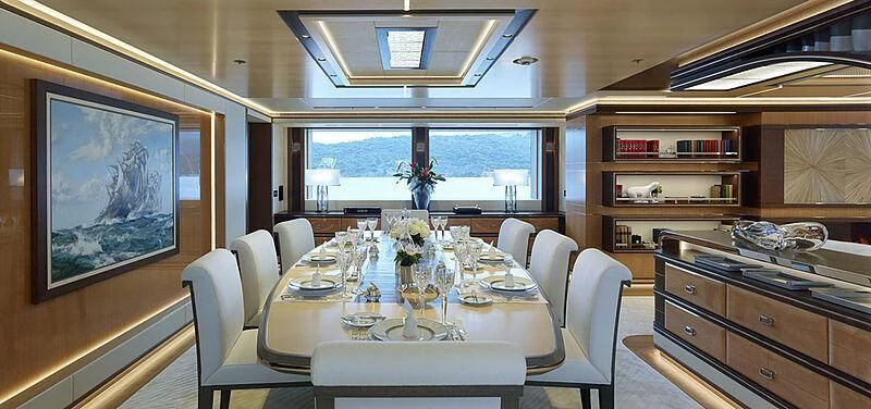 a dining room with a large window aboard GAJA Yacht for Sale