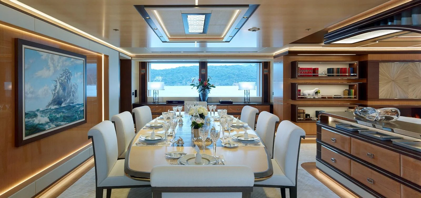 a dining room with a large window aboard GAJA Yacht for Sale