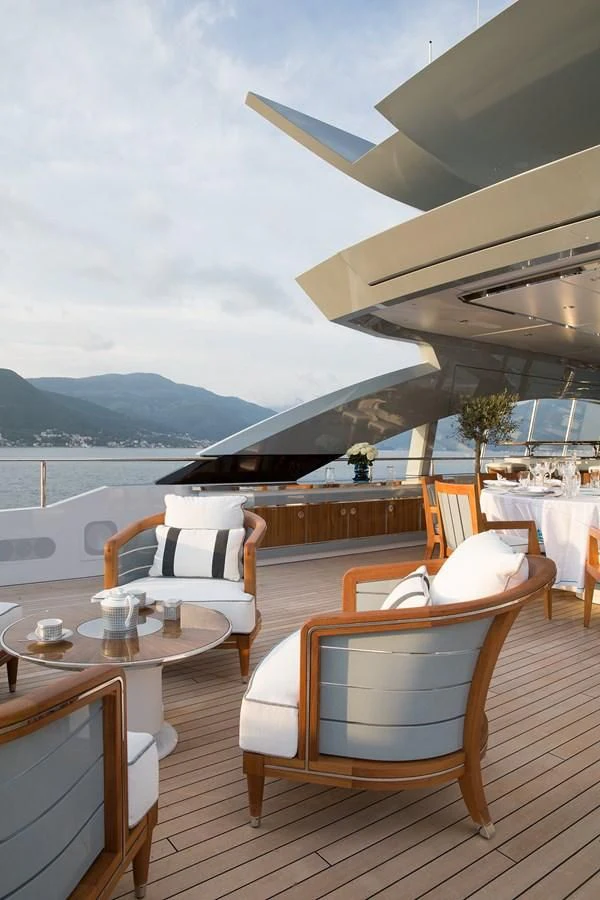 a room with a table and chairs aboard GAJA Yacht for Sale
