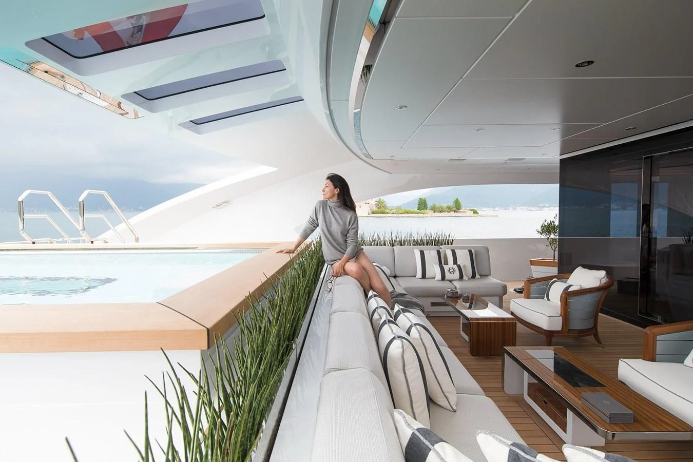 a person sitting on a couch aboard GAJA Yacht for Sale