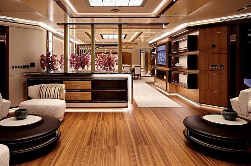 a room with a piano and a wood floor aboard GAJA Yacht for Sale