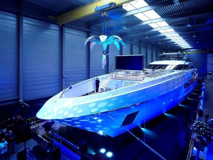 a large white boat in a large room with a large screen aboard GAJA Yacht for Sale