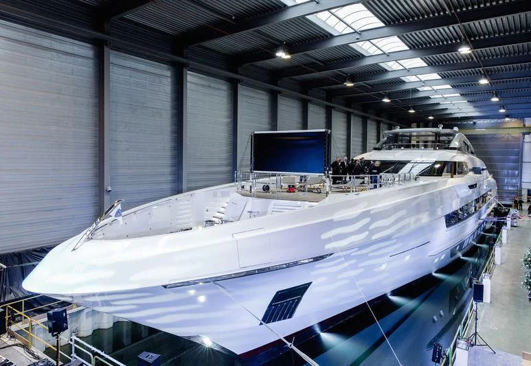 a large white boat in a warehouse aboard GAJA Yacht for Sale