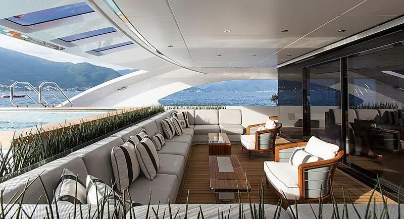 a deck with chairs and a view of the ocean aboard GAJA Yacht for Sale