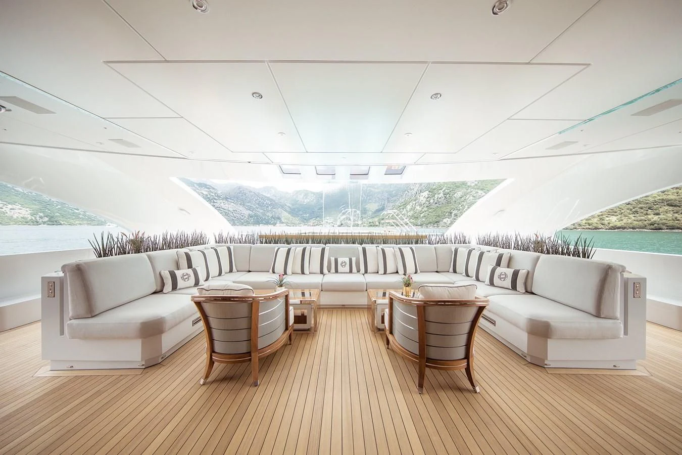 a room with a couch and a table and chairs aboard GAJA Yacht for Sale