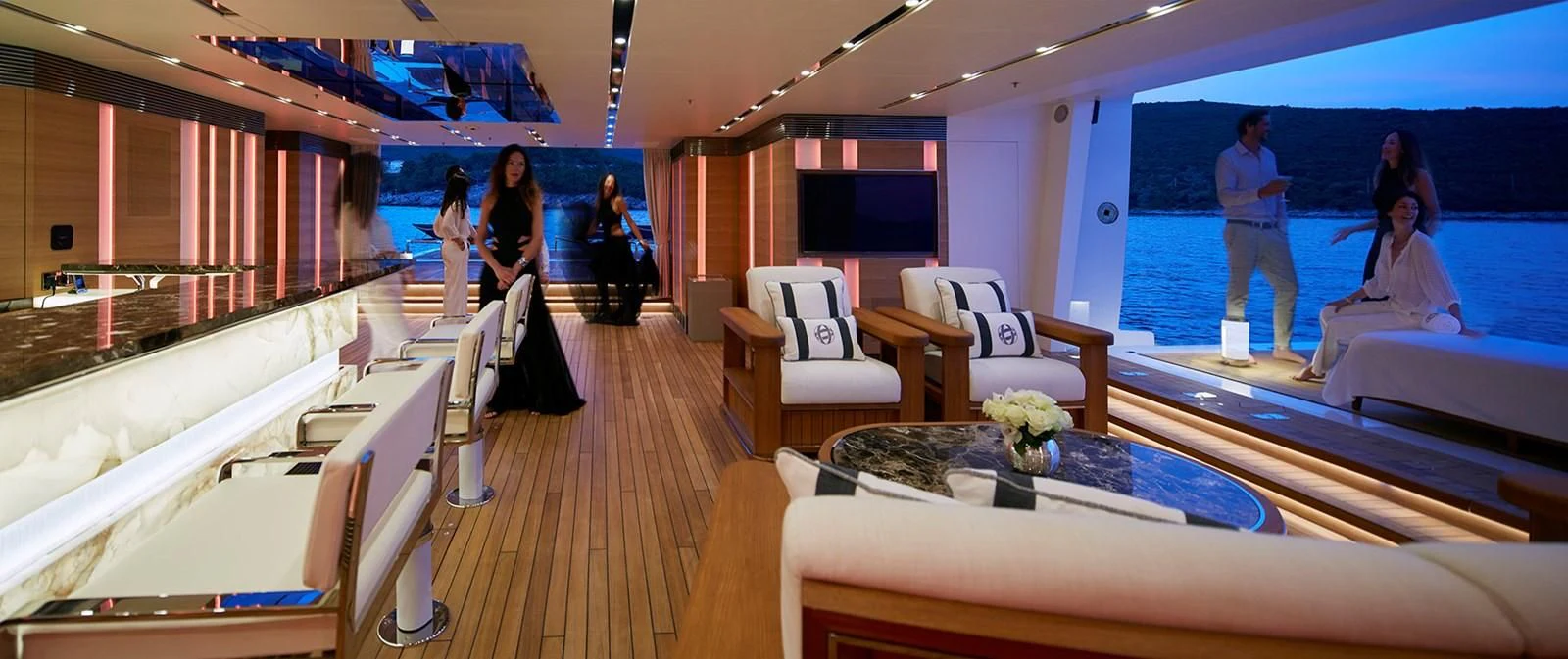 a room with a table and chairs aboard GAJA Yacht for Sale