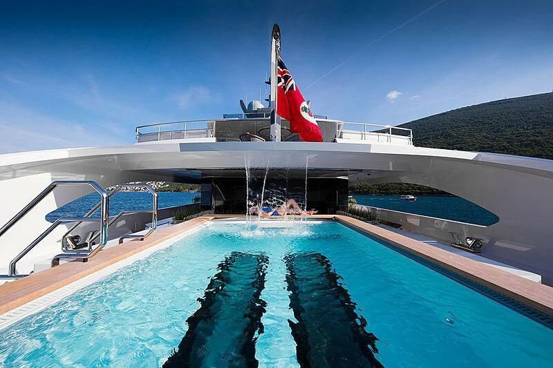 a large building with a flag on the roof aboard GAJA Yacht for Sale