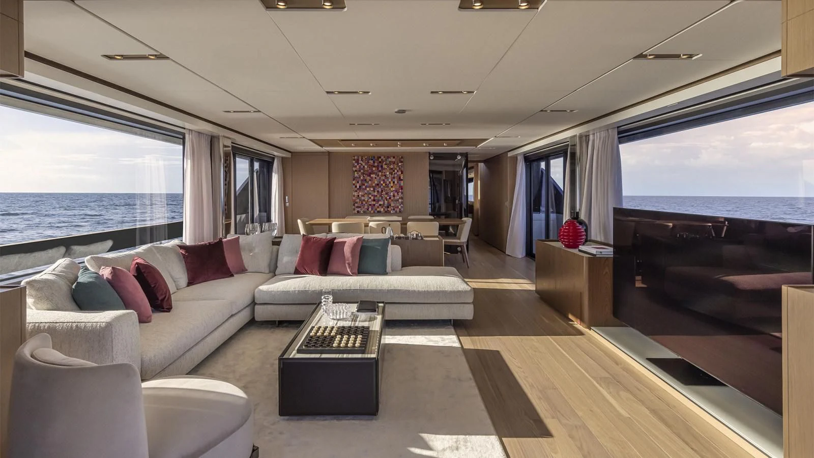 a living room with a large window aboard FERRETTI 1000 Yacht for Sale