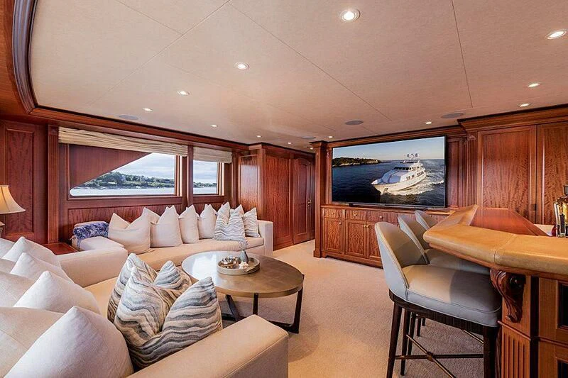 a living room with a large screen aboard MAMAMIA Yacht for Sale
