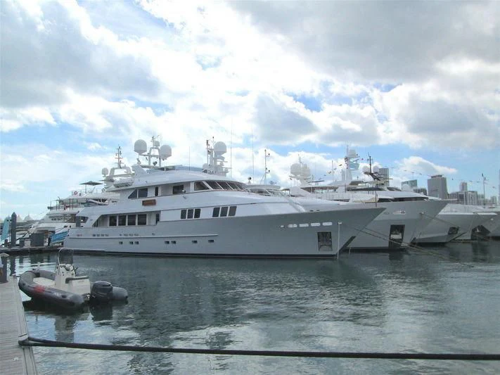 a large white yacht docked aboard MAMAMIA Yacht for Sale