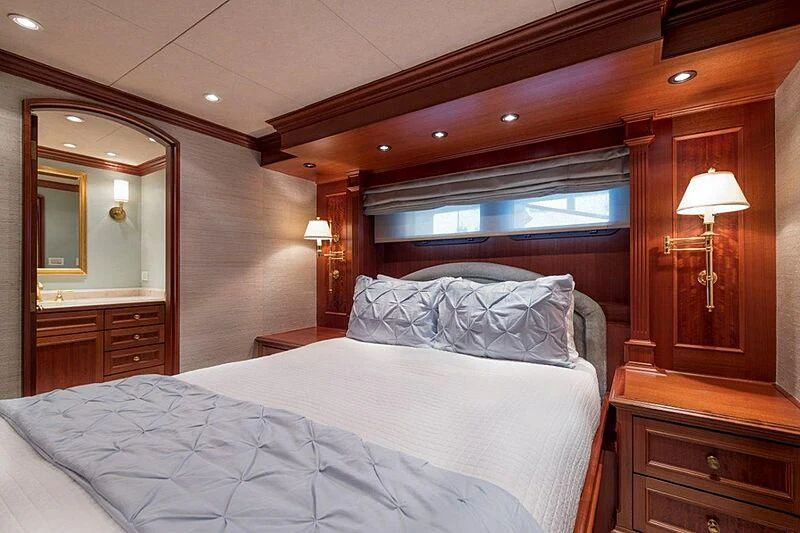 a bedroom with a large bed aboard MAMAMIA Yacht for Sale