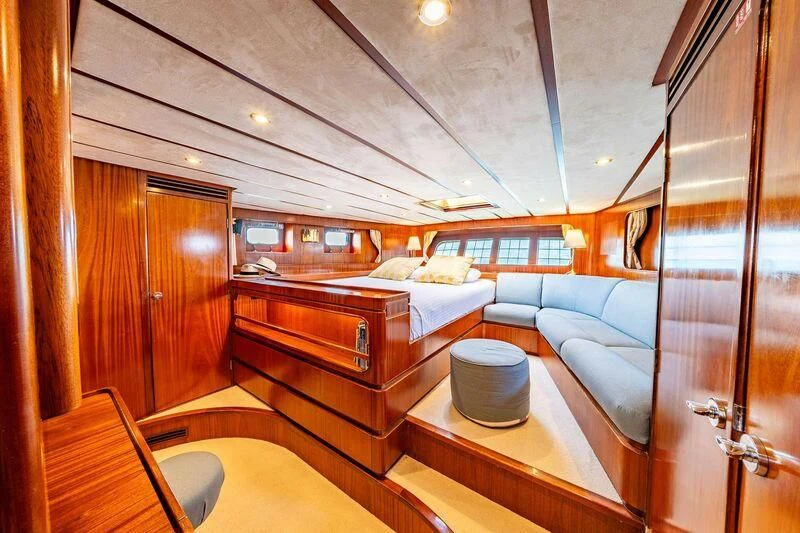 a room with a bed and a couch aboard GUADALUPE Yacht for Sale