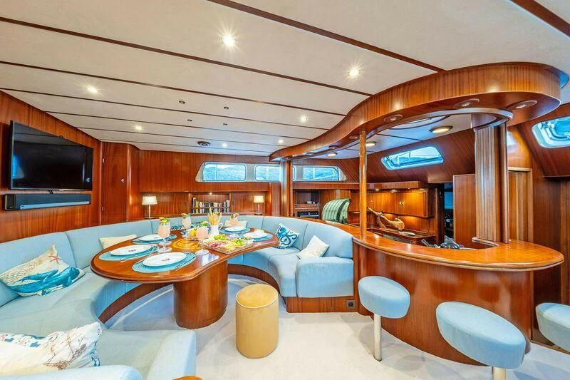 a room with a table and chairs aboard GUADALUPE Yacht for Sale