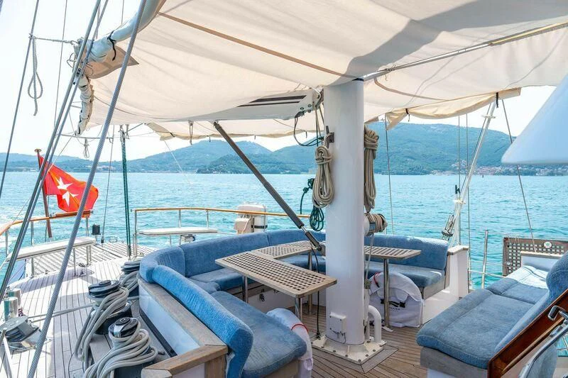 a boat with a flag on the front aboard GUADALUPE Yacht for Sale