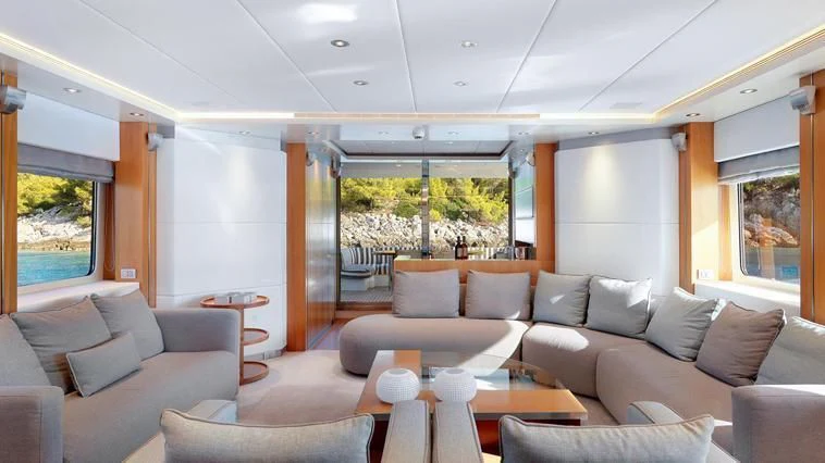 a living room with a large window aboard ALMA Yacht for Sale
