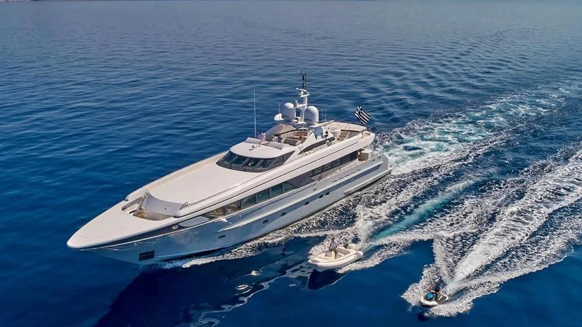 a white yacht on the water aboard ALMA Yacht for Sale