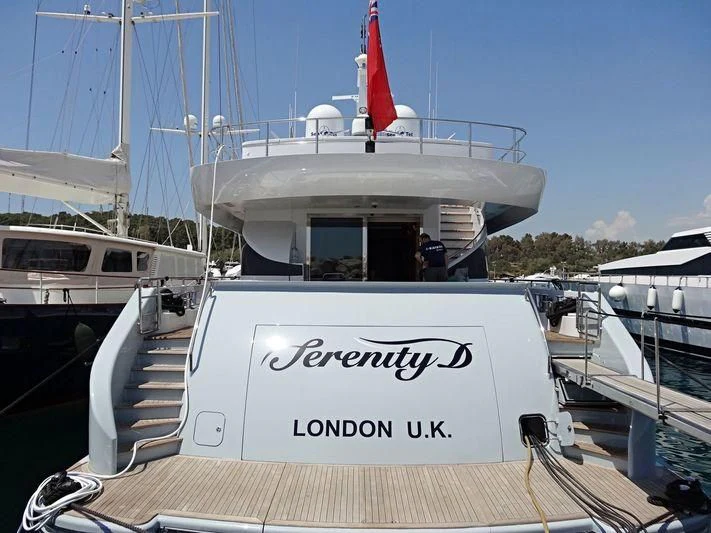 a boat with a flag on the front aboard ALMA Yacht for Sale