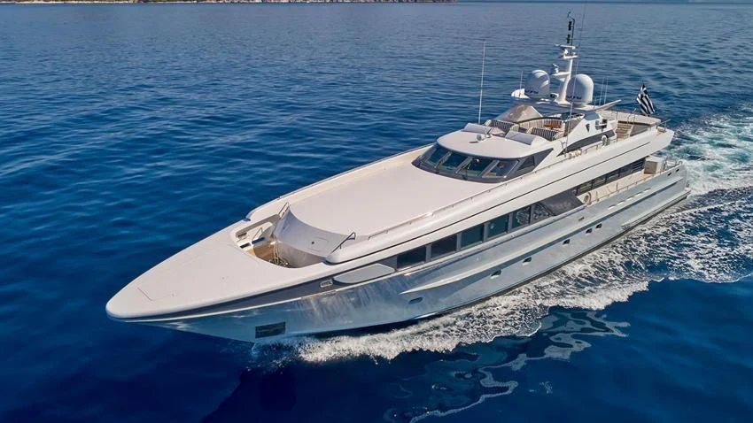 a white yacht on the water aboard ALMA Yacht for Sale