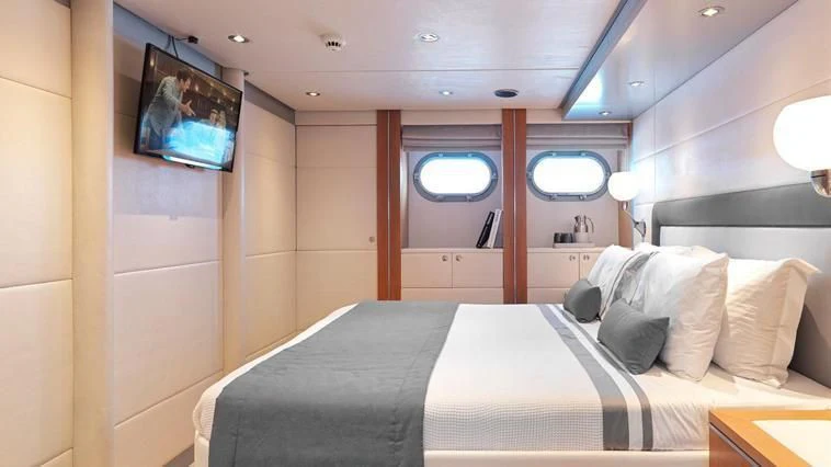 a bed in a room aboard ALMA Yacht for Sale